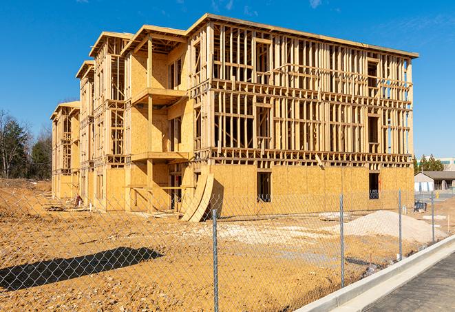 a snapshot of temporary chain link fences protecting a large construction project from unauthorized access in Farmersville